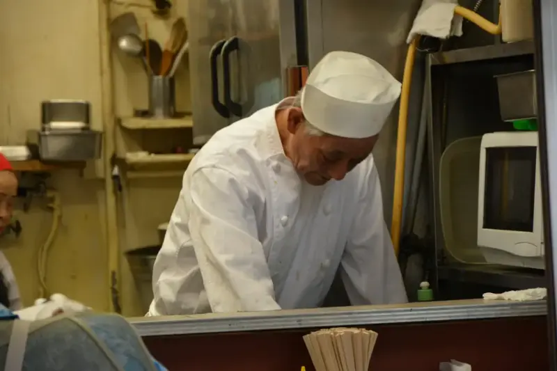 Chef preparing ingredients in kitchen